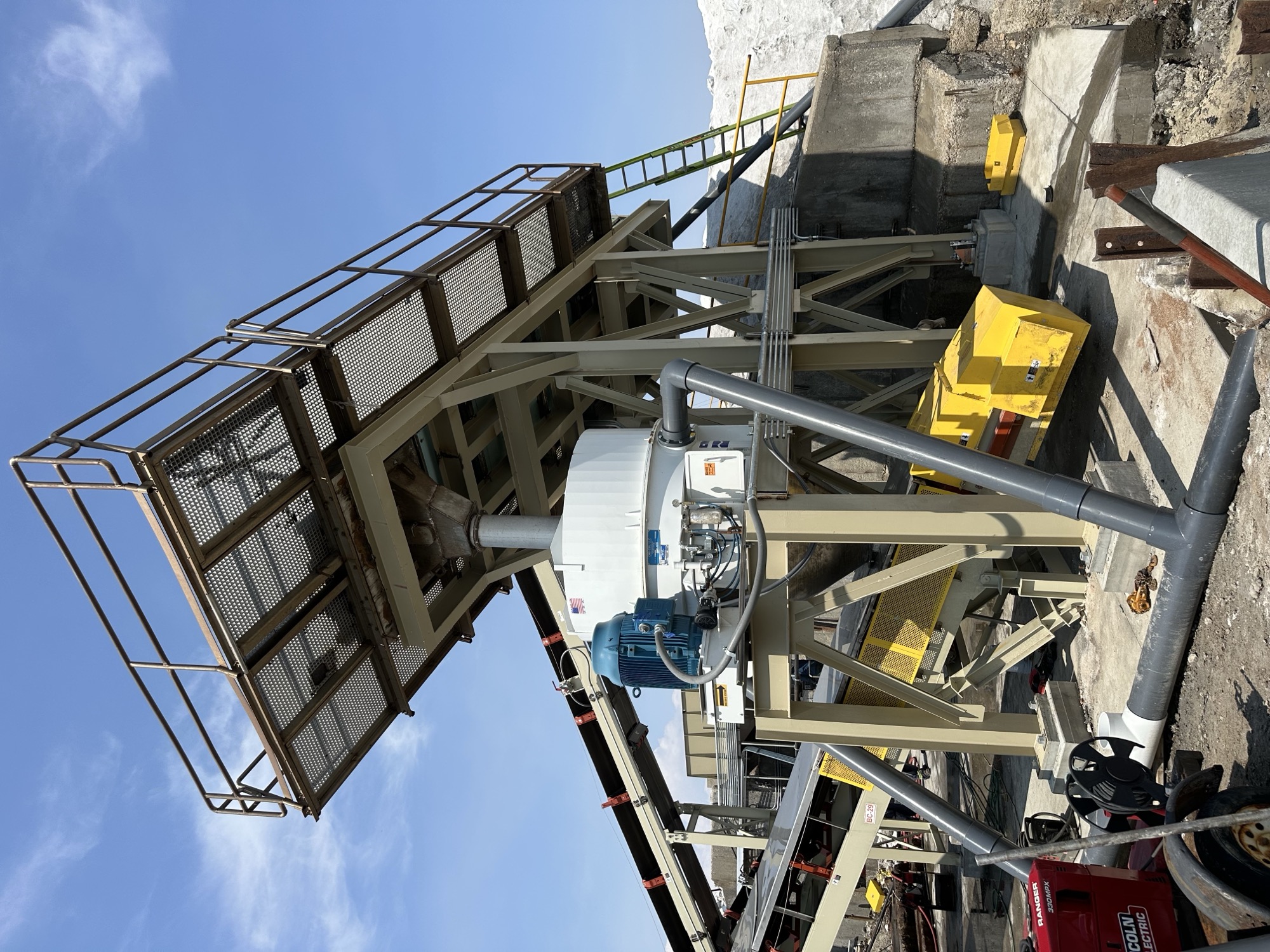 Dewatering and separation systems including centrifuges, air bed dryers and rotating kilns